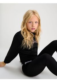Sinsay - Legginsy Barbie - czarny. Kolor: czarny