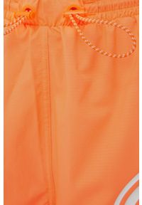 Adidas by Stella McCartney - adidas by Stella McCartney szorty do biegania Truepace damskie kolor pomarańczowy z nadrukiem medium waist. Kolor: pomarańczowy. Materiał: dzianina, materiał. Wzór: nadruk