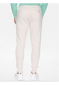 Calvin Klein Jeans Spodnie dresowe J30J322917 Beżowy Regular Fit. Kolor: beżowy. Materiał: syntetyk, bawełna