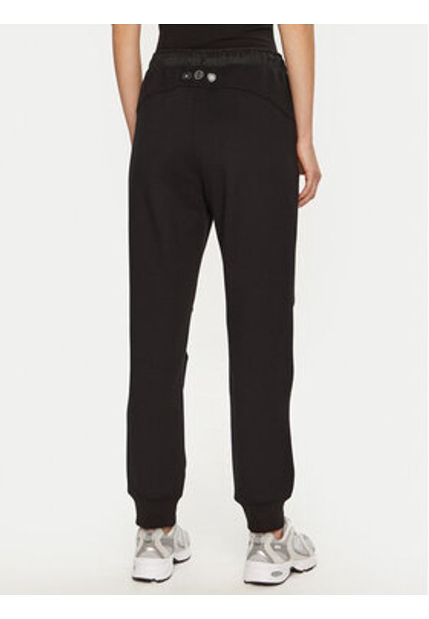 Champion Spodnie dresowe 117477 Czarny Slim Fit. Kolor: czarny. Materiał: syntetyk