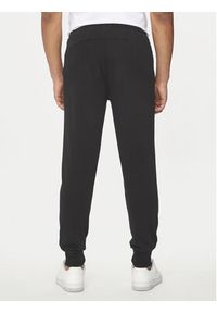 Puma Spodnie dresowe Ess Logo 586716 Czarny Regular Fit. Kolor: czarny. Materiał: bawełna, syntetyk