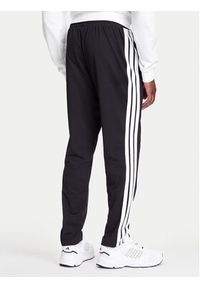 Adidas - adidas Spodnie dresowe Essentials 3-Stripes JE6430 Czarny Regular Fit. Kolor: czarny. Materiał: bawełna #4