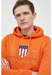 GANT - Gant bluza męska kolor pomarańczowy z kapturem z aplikacją. Okazja: na co dzień. Typ kołnierza: kaptur. Kolor: pomarańczowy. Wzór: aplikacja. Styl: casual
