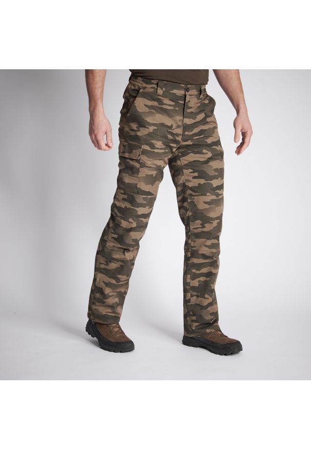 SOLOGNAC - Spodnie Warm 100 camo haltfone. Kolor: beżowy. Materiał: materiał