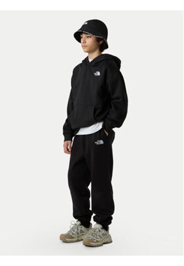 The North Face Spodnie dresowe Essential NF0A8BHS Czarny Regular Fit. Kolor: czarny. Materiał: bawełna, syntetyk