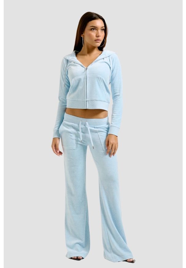 Juicy Couture - JUICY COUTURE Błękitne damskie spodnie dresowe Layla Low Rise Pocket. Kolor: niebieski. Materiał: dresówka