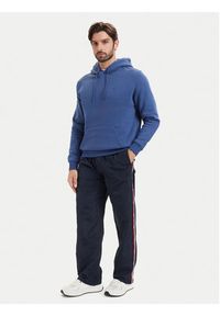 Tommy Jeans Spodnie dresowe DM0DM23123 Granatowy Relaxed Fit. Kolor: niebieski. Materiał: syntetyk #5