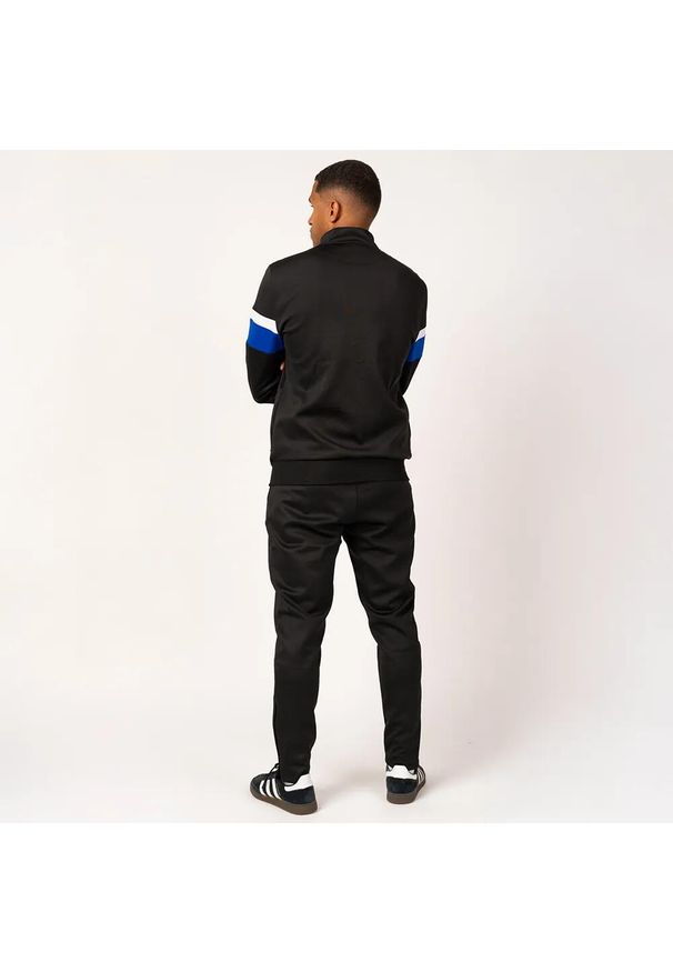 Dres piłkarski dla dorosłych Real Madrid. Kolor: wielokolorowy, niebieski, biały, czarny. Materiał: dresówka. Sport: piłka nożna