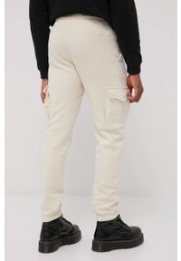 Jack & Jones spodnie męskie kolor beżowy gładkie. Kolor: beżowy. Materiał: dzianina. Wzór: gładki #3