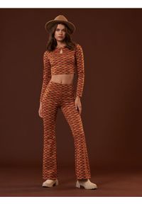 Sinsay - Spodnie flare - wielobarwny. Materiał: dzianina. Styl: retro