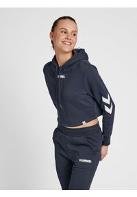 Damska bluza z kapturem crop top Hummel hmlLEGACY. Typ kołnierza: kaptur. Kolor: niebieski, zielony, wielokolorowy. Materiał: materiał, bawełna. Wzór: nadruk. Sport: fitness, piłka ręczna