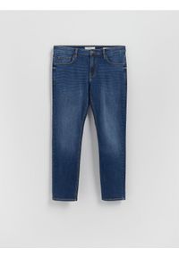Reserved - Jeansy slim z efektem sprania - granatowy. Kolor: niebieski #1