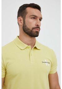 Calvin Klein Jeans polo męski kolor żółty z nadrukiem. Typ kołnierza: polo. Kolor: żółty. Materiał: dzianina. Długość: krótkie. Wzór: nadruk #5