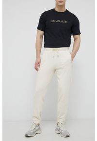 Reebok Classic Spodnie bawełniane H54448 męskie kolor kremowy gładkie. Kolor: beżowy. Materiał: bawełna. Wzór: gładki
