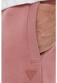 Guess spodnie dresowe kolor różowy melanżowe. Kolor: różowy. Materiał: dresówka. Wzór: melanż #3