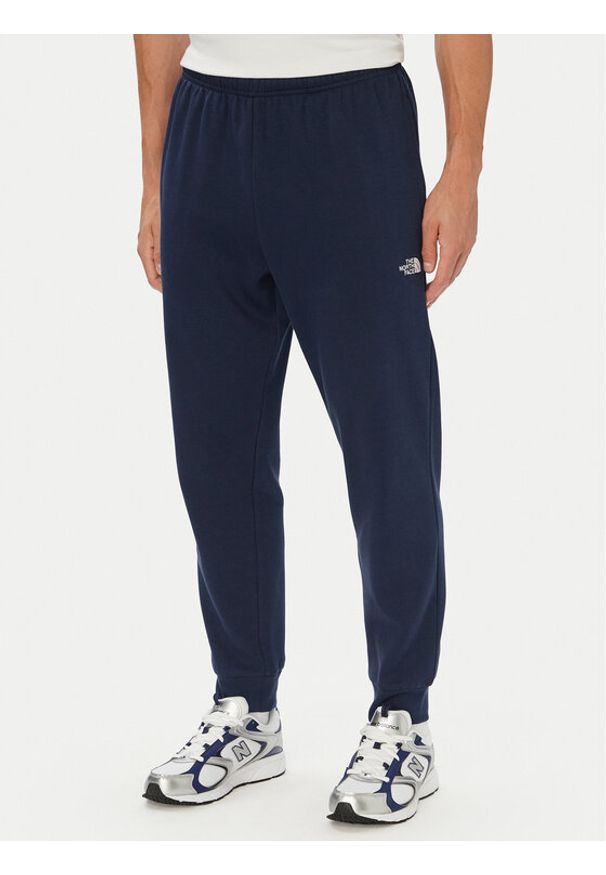 The North Face Spodnie dresowe Evolution Simple Dome NF0A8CWY Granatowy Regular Fit. Kolor: niebieski. Materiał: syntetyk