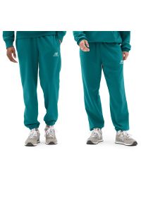 Spodnie New Balance UP21500VDA - niebieskie. Kolor: niebieski. Materiał: dresówka, materiał, bawełna, poliester. Sport: fitness