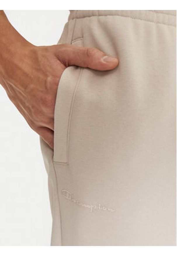 Champion Spodnie dresowe 220424 Écru Regular Fit. Materiał: bawełna, syntetyk