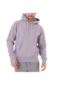 Bluza Champion Hooded Sweatshirt 218800-VM004 - fioletowa. Typ kołnierza: kaptur. Kolor: fioletowy. Materiał: tkanina, bawełna, poliester. Wzór: aplikacja. Styl: sportowy, klasyczny