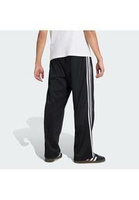 Adidas - adidas Spodnie dresowe adicolor KE3501 Czarny Loose Fit. Kolor: czarny. Materiał: bawełna #2