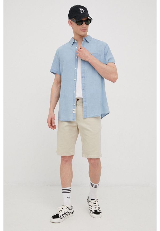 Tommy Jeans szorty SCANTON męskie kolor beżowy. Kolor: beżowy. Materiał: materiał, tkanina. Wzór: gładki