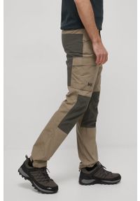 Helly Hansen spodnie outdoorowe Vandre męskie kolor beżowy. Kolor: beżowy. Materiał: materiał, włókno, bawełna, softshell, poliester