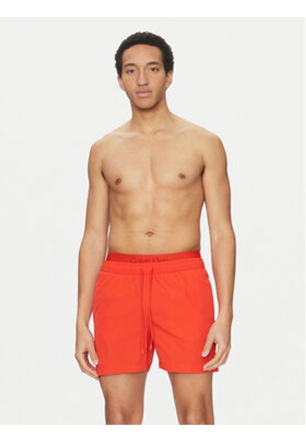 Calvin Klein Swimwear Szorty kąpielowe KM0KM01104 Czerwony Regular Fit. Kolor: czerwony. Materiał: syntetyk