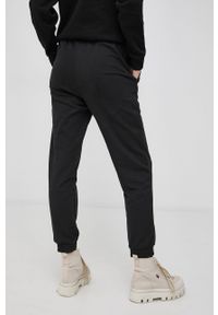 Puma Spodnie 589489 damskie kolor czarny gładkie. Kolor: czarny. Materiał: materiał, dzianina. Wzór: gładki #3