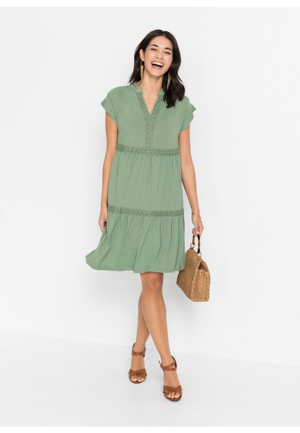 bonprix - Sukienka tunikowa z miękkiej mieszanki wiskozy. Kolor: zielony. Materiał: wiskoza, koronka. Wzór: koronka