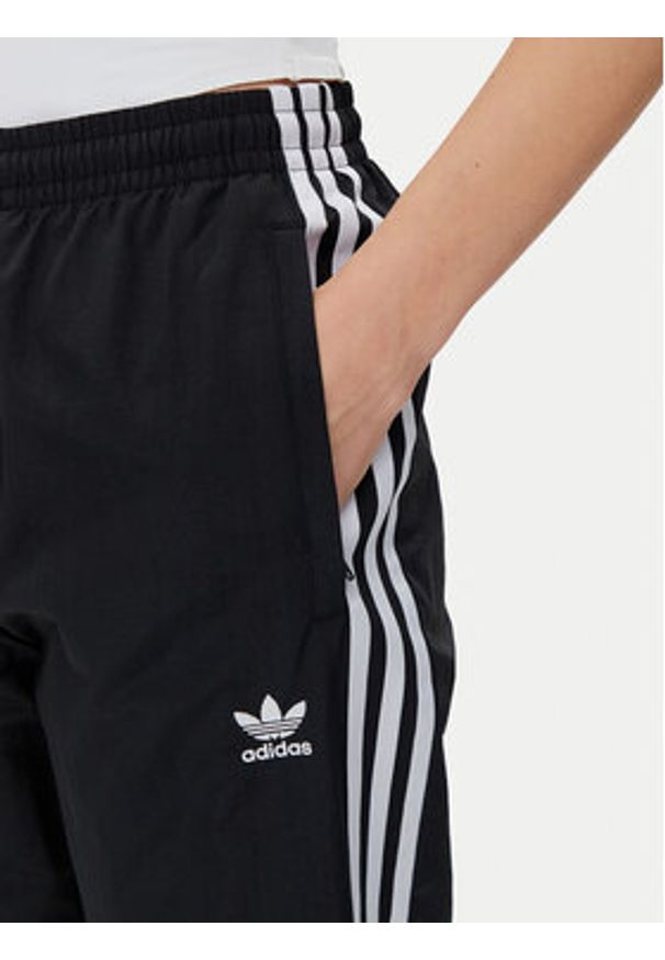 Adidas - adidas Spodnie dresowe Woven JD5335 Czarny Loose Fit. Kolor: czarny. Materiał: syntetyk