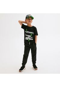 Reserved - Dresowe spodnie z efektem sprania - Czarny. Kolor: czarny. Materiał: dresówka #1