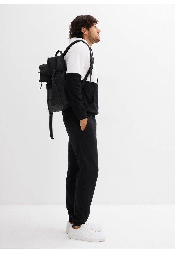 bonprix - Spodnie dresowe z prążkowanym ściągaczem w talii. Kolor: czarny. Materiał: prążkowany, dresówka. Styl: sportowy