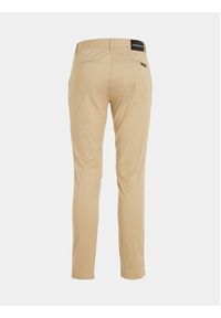 Calvin Klein Jeans Chinosy J30J317669 Beżowy Slim Fit. Kolor: beżowy. Materiał: bawełna