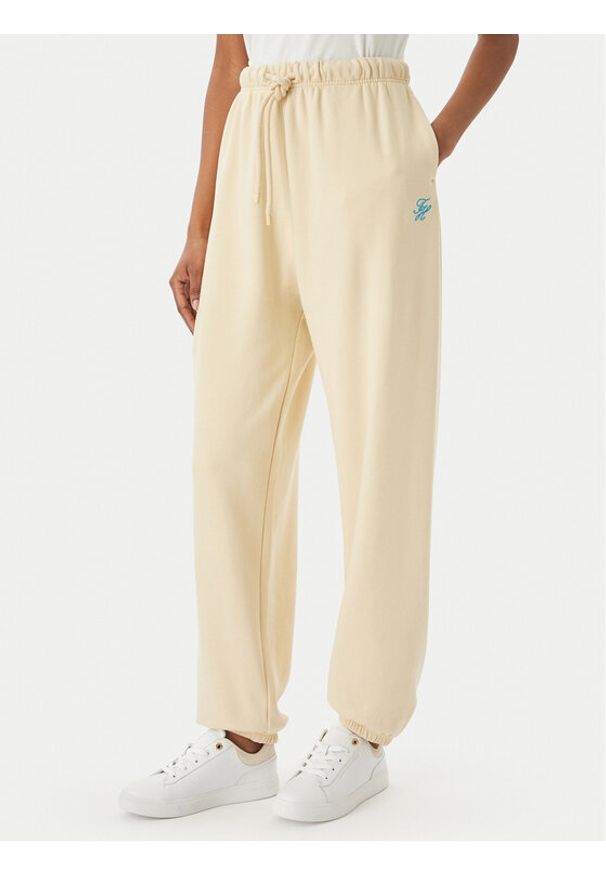 TOMMY HILFIGER - Tommy Hilfiger Spodnie dresowe Logo Embroidery WW0WW49706 Beżowy jasny Regular Fit. Kolor: beżowy. Materiał: bawełna
