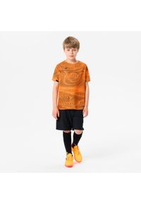 KIPSTA - Koszulka piłkarska dla dzieci Kipsta Club Wavy. Kolor: czarny, pomarańczowy, wielokolorowy. Materiał: tkanina, poliester, materiał. Sezon: lato. Sport: piłka nożna