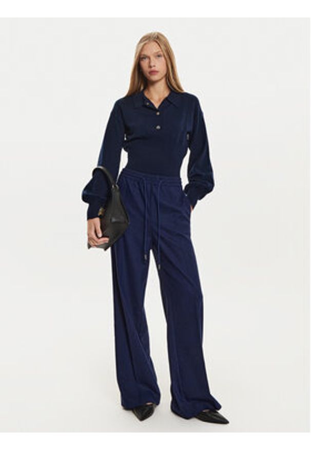 BOSS Spodnie dresowe Tavite1 50528604 Granatowy Relaxed Fit. Kolor: niebieski. Materiał: syntetyk