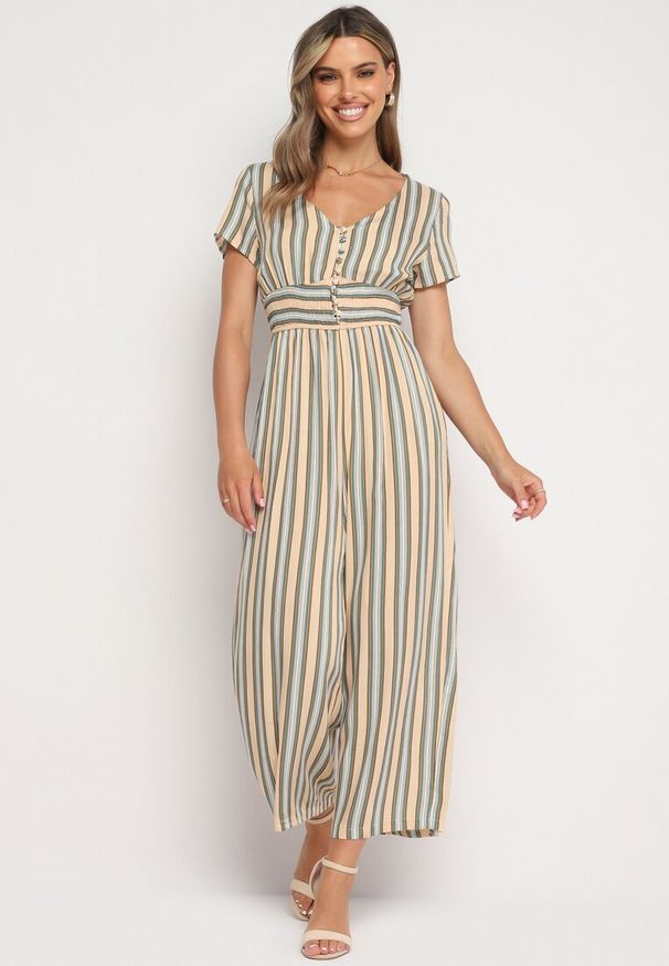 Born2be - Beżowy Wiskozowy Kombinezon z Guzikami przy Dekolcie i Elastyczną Gumką w Talii Tinaleias. Okazja: do pracy, na co dzień. Kolor: beżowy. Materiał: wiskoza. Długość: długie. Wzór: aplikacja. Styl: klasyczny, casual