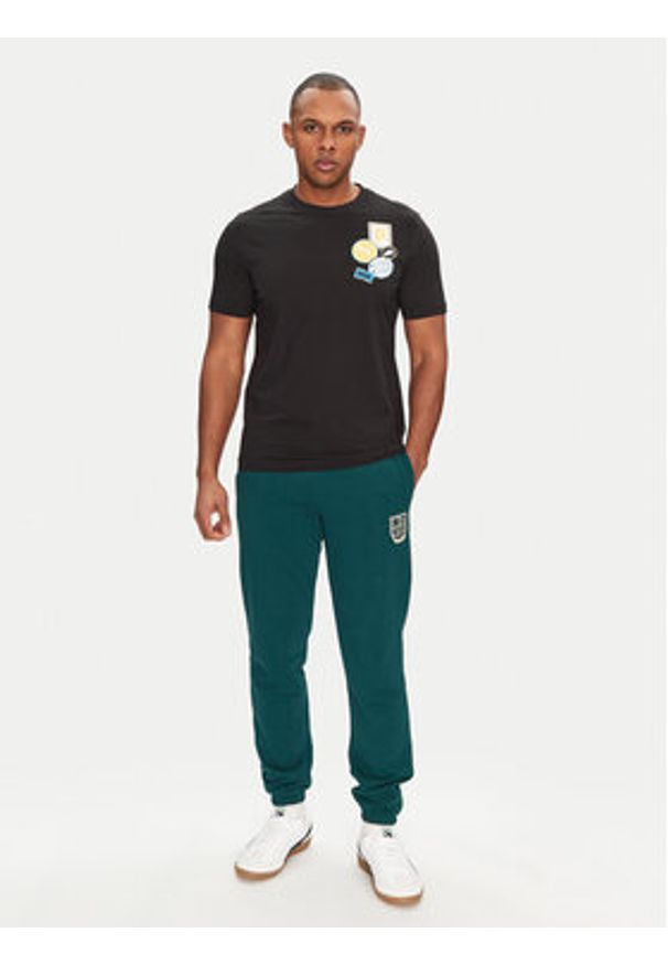 Puma T-Shirt Graphics Icon 684829 Czarny Regular Fit. Kolor: czarny. Materiał: bawełna