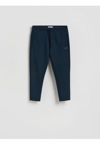 Reserved - Spodnie dresowe slim - granatowy. Kolor: niebieski. Materiał: dresówka