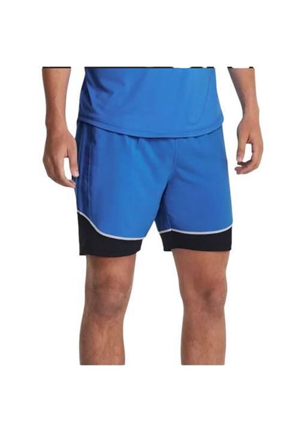 Spodnie sportowe męskie Under Armour 1379453464. Kolor: niebieski. Materiał: materiał, syntetyk. Długość: krótkie. Sport: piłka nożna