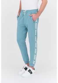 Guess - GUESS Turkusowe dresowe spodnie New Arlo. Kolor: niebieski. Materiał: dresówka #2
