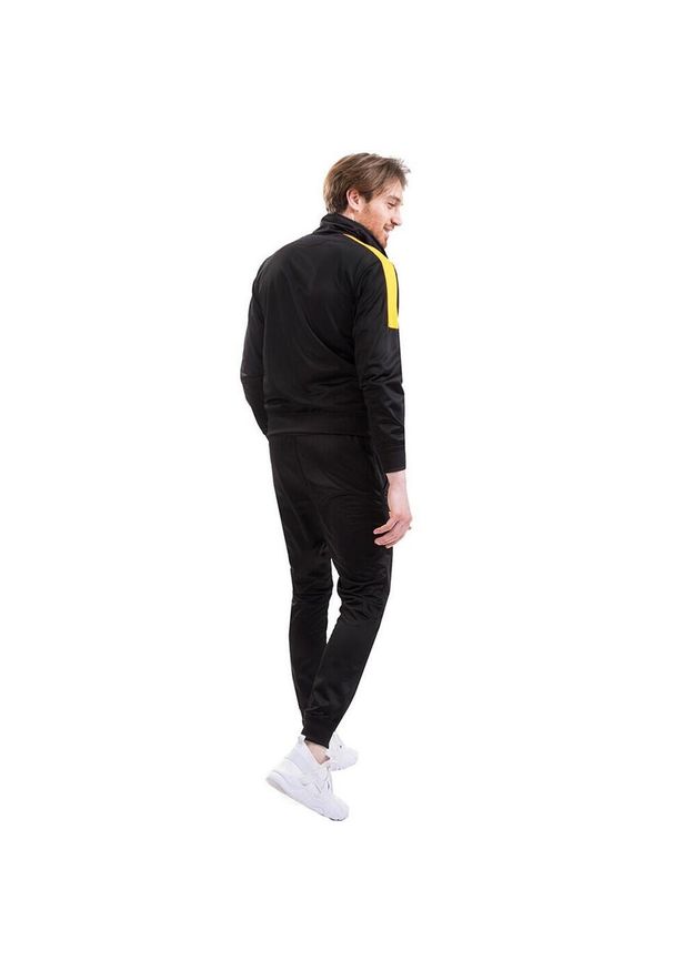 Givova - Dres Męski Tuta Revolution. Kolor: czarny, żółty, wielokolorowy. Materiał: dresówka