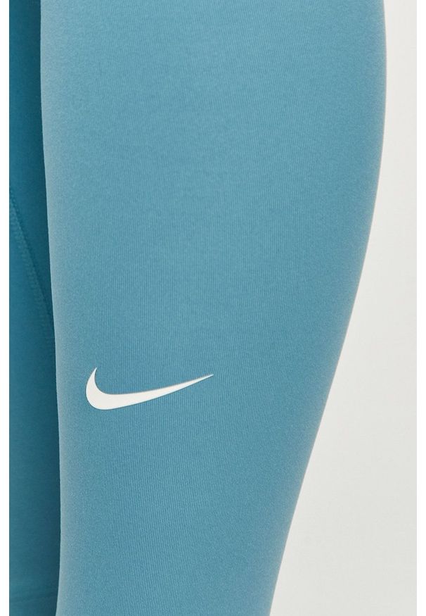 Nike - Legginsy. Stan: podwyższony. Kolor: niebieski. Materiał: włókno, skóra, tkanina. Technologia: Dri-Fit (Nike)