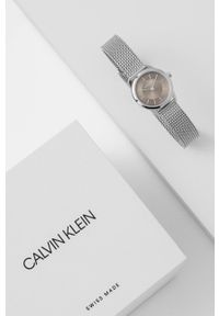 Calvin Klein Zegarek K3M23124 damski kolor szary. Kolor: szary. Materiał: materiał