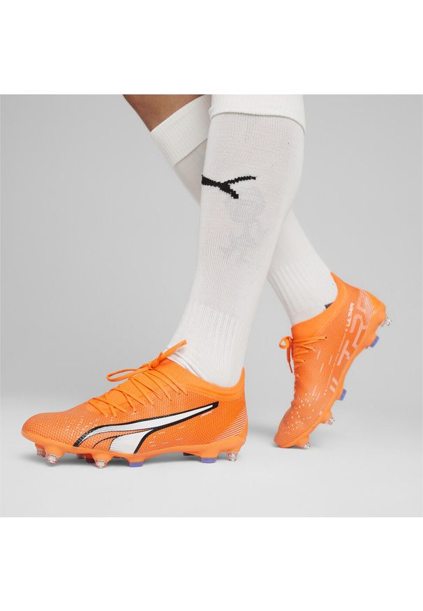 Buty piłkarskie męskie Puma Ultra Match Mxsg. Zapięcie: sznurówki. Kolor: biały, niebieski, pomarańczowy, wielokolorowy. Materiał: syntetyk, materiał. Szerokość cholewki: normalna. Sport: piłka nożna