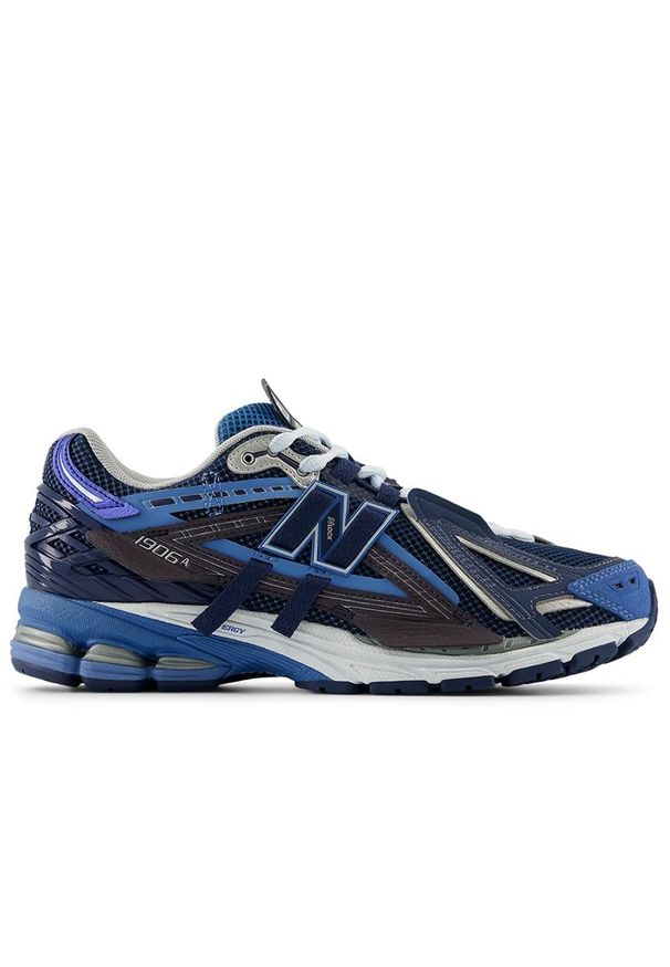 Buty New Balance U1906AB - niebieskie. Kolor: niebieski. Materiał: guma, syntetyk, materiał. Szerokość cholewki: normalna. Sport: turystyka piesza