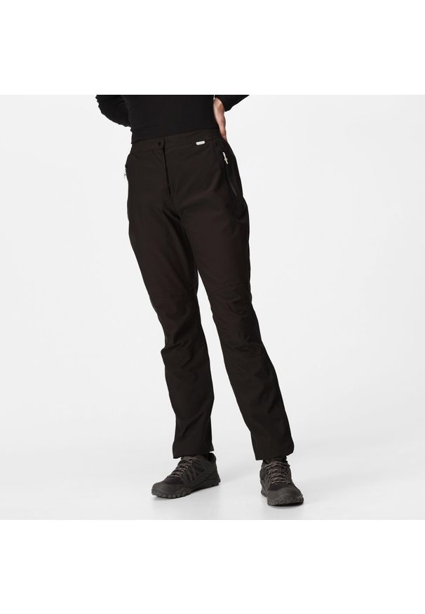 Regatta - Damskie spodnie ochronne wodoodporne Highton czarne. Kolor: czarny, brązowy, szary, wielokolorowy. Sezon: lato. Sport: turystyka piesza