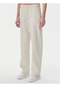 Puma Spodnie dresowe Ess 629774 Beżowy Straight Fit. Kolor: beżowy. Materiał: syntetyk, bawełna