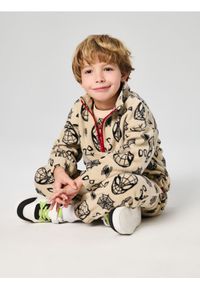 Sinsay - Spodnie jogger Spiderman - beżowy. Kolor: beżowy. Wzór: motyw z bajki