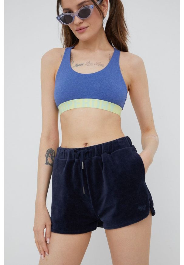 Superdry szorty damskie kolor granatowy gładkie medium waist. Kolor: niebieski. Materiał: welur. Wzór: gładki